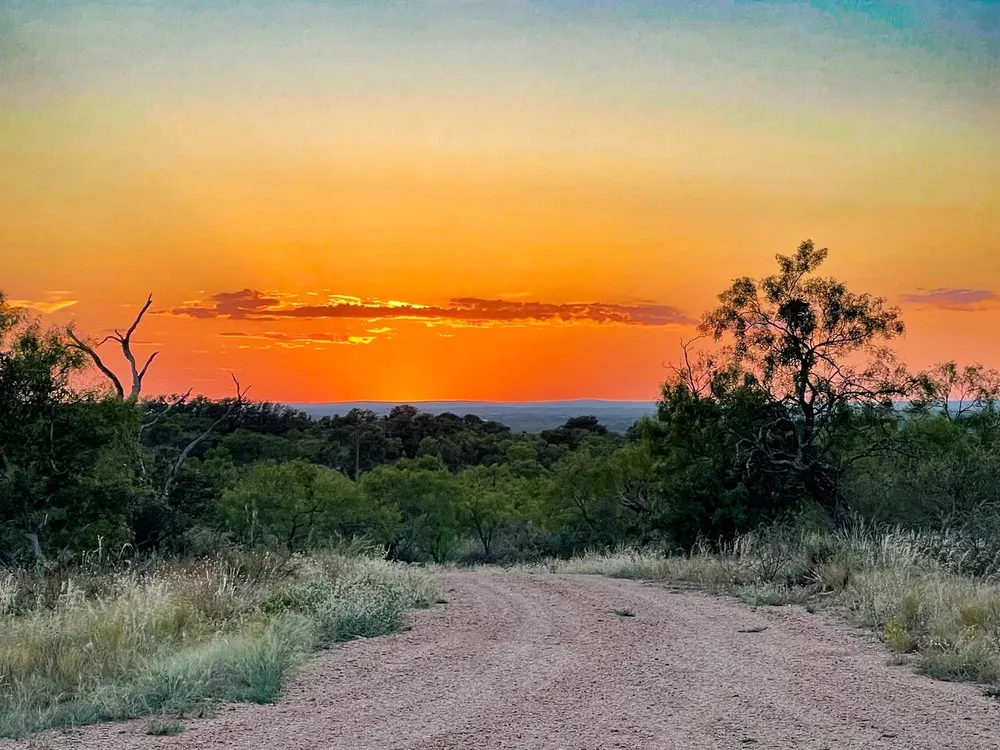 Hill Country sunset over the trail at BarndoBnB