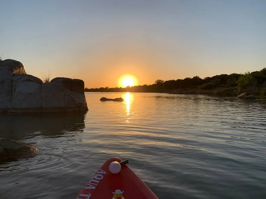 Kayaking the Llano River at sunset near BarndoBnB