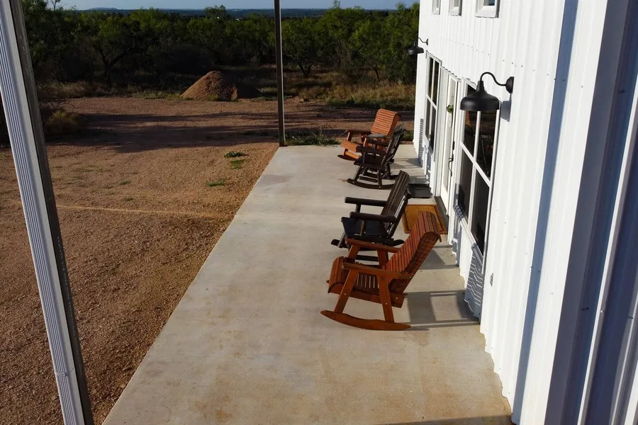 Rocking chairs on the quiet front porch at BarndoBnB