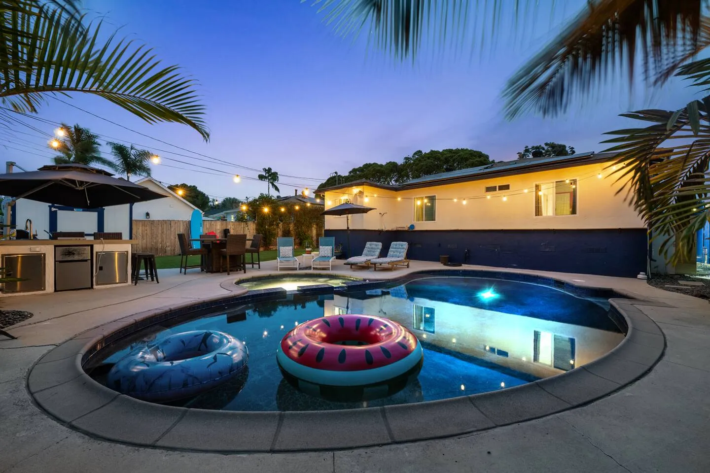 The lit pool at South O&rsquo;asis in Oceanside at dusk